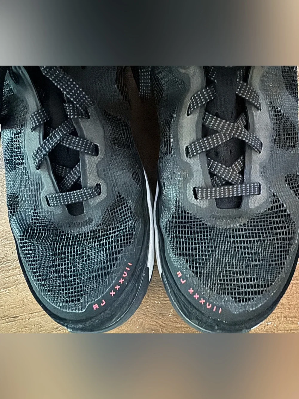 Boy’s Nike Air Jordan XXXVII Black Hot Punch basketball shoes.